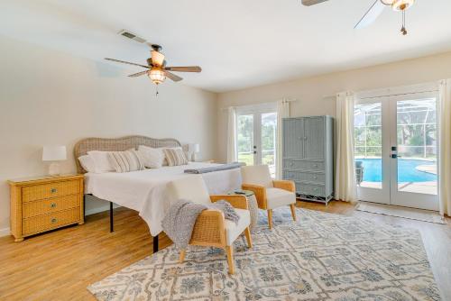 a bedroom with a bed and a table and chairs at Cozy Ocala Retreat with Pool, Screened Lanai! in Ocala