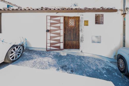 a garage with a door and a car parked next to it at Nonna Cuncetta in Noto