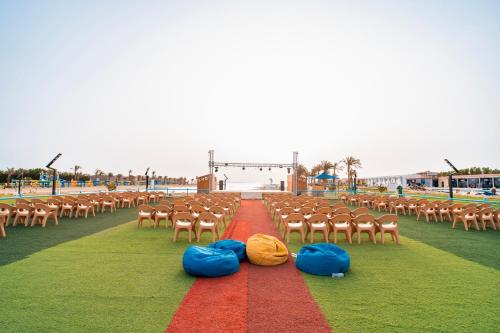 a row of chairs with bags on the ground at Gravity Hotel & Aqua Park Hurghada Families and Couples Only in Hurghada