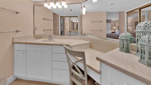 a bathroom with a sink and a mirror at Inlet Reef 215 - Spacious condo with complimentary seasonal beach service and great water views in Destin
