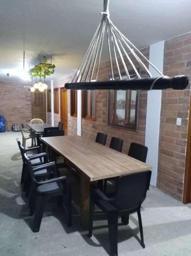 a dining room table with chairs and a largeoit at DONDE...MONIK in Arboletes