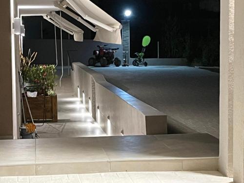 a night view of a building with a ramp with lights at Stbs Luxury, Nea Fokea in Nea Fokea