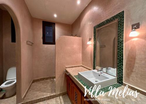 a bathroom with a sink and a toilet at Villa Melias in Marrakesh