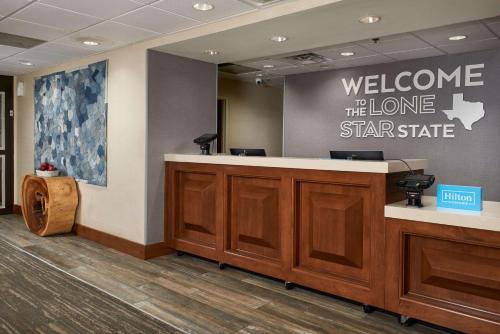 a welcomeelcome to the home star state sign in a lobby at Hampton Inn Beaumont in Beaumont
