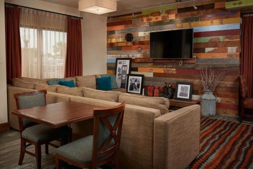 a living room with a couch and a table at Hampton Inn Beaumont in Beaumont
