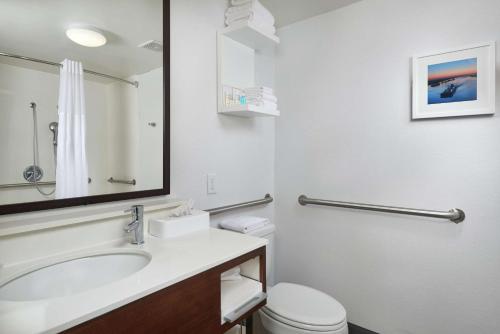 a bathroom with a sink and a toilet at Hampton Inn Beaumont in Beaumont