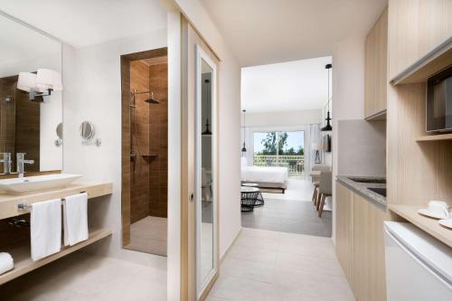 a bathroom with a shower and a sink at Radisson Blu Residences, Saidia in Saidia 
