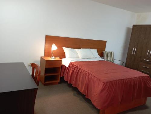 Ein Bett oder Betten in einem Zimmer der Unterkunft Hotel el sol de los incas