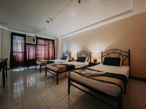 Katil atau katil-katil dalam bilik di Fuente Hotel de Cebu