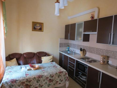 a kitchen with a bed and a sink in a room at Otdyh u Morya in Odesa