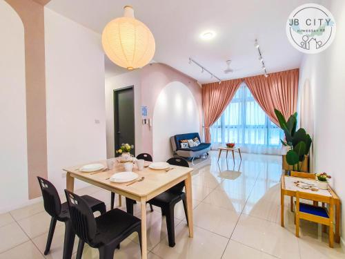 a dining room and living room with a table and chairs at Skudai Paradigm Mall by RR JBcity in Johor Bahru