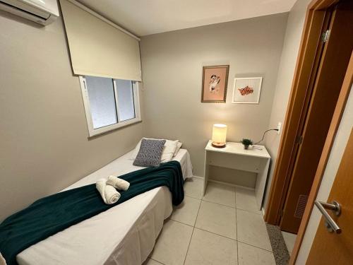 En eller flere senge i et værelse på Porto Beach Conforto e Lazer a 200m do B Park