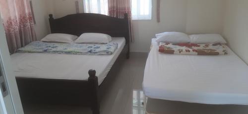 Giường trong phòng chung tại Xuan Luom Guesthouse