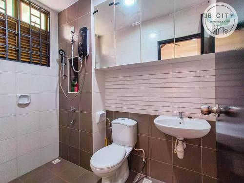 a bathroom with a toilet and a sink at Two-Nine Muslim Villa by RR JBcity in Johor Bahru