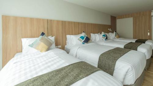 Postel nebo postele na pokoji v ubytování Bella B Hotel