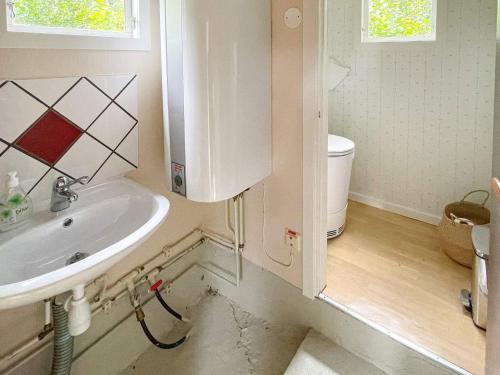 a bathroom with a sink and a toilet at Holiday home KARLSHAMN III in Karlshamn