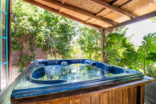 a blue tub sitting on top of a deck at Tafat's Haven Lodge in Nurit
