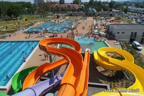 a view of a pool with a water park at GÁRDI APARTMAN in Szekszárd