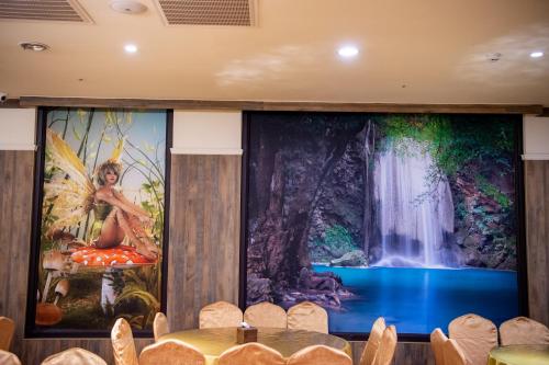 a stage with a large painting on the wall at Fantasy Palace in Yuchi