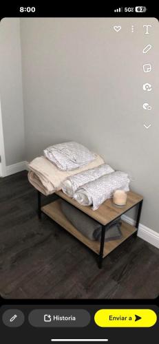 a bed sitting on top of a wooden table in a room at Cerca aeropuerto in Mexico City