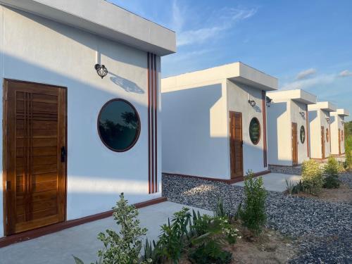 a rendering of a house with a door at Muji House Resort in Non Sang