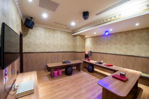 a conference room with two tables and a screen at Fantasy Palace in Yuchi