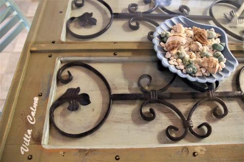 a plate of food on top of a wooden table at Symi . VILLA CALME (Sur la Mer). in Symi