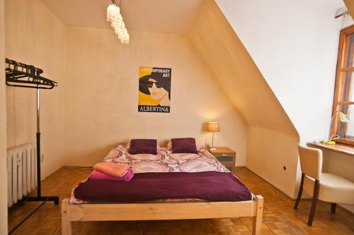 a bedroom with a bed in a attic at Center Rynek in Wrocław