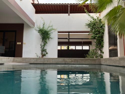 a swimming pool in front of a house at PB 2 recamaras, alberca y futbolito in San Carlos