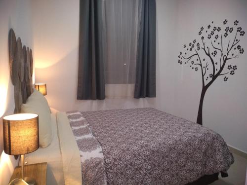A bed or beds in a room at Paraíso Casa Turquesa Playa del Carmen