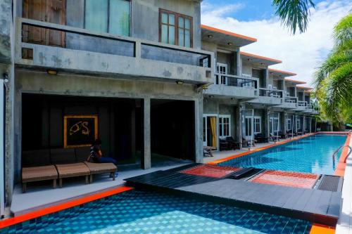 a villa with a swimming pool in a resort at See Through Resort Haad Yao in Haad Yao