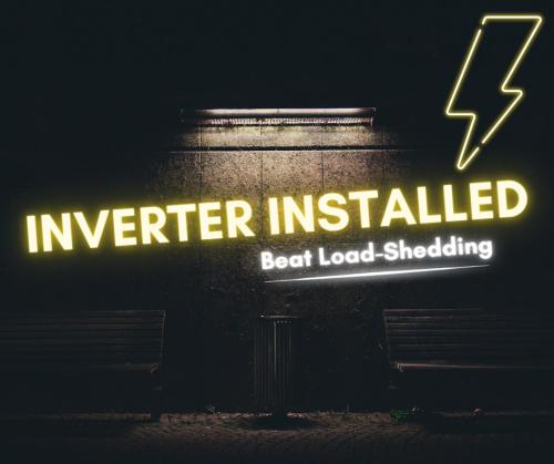 a sign that reads inverter installed next to a bench at San Lameer 2820 by Top Destinations Rentals in Southbroom