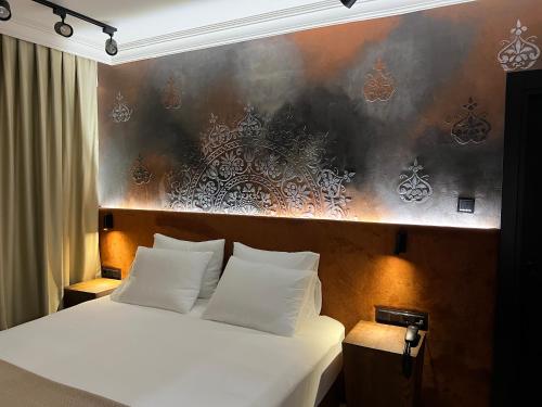 Katil atau katil-katil dalam bilik di Oji Hotel