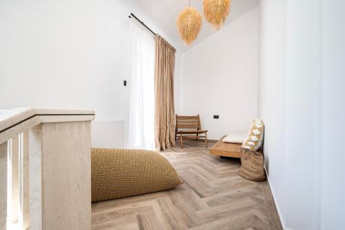 a living room with a couch and a table at RASTONI VILLAS BY AEGEAN HOUSES in Psalidi