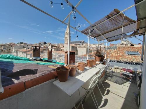 En balkon eller terrasse på Superbe T3 terrasse avec vue Centre historique