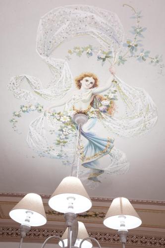 a painting of an angel on a ceiling at Regina Stella in Lascari