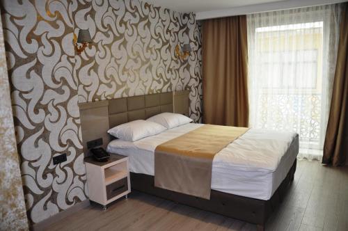 Postel nebo postele na pokoji v ubytování Colonia Park Otel