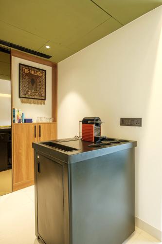 an office with a counter with a toaster on it at Indie Stays Jaipur in Jaipur