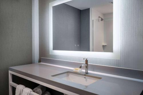a bathroom with a sink and a mirror at Wyndham Westfield in Westfield