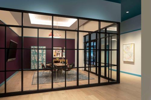 a room with a large glass wall at Hyatt Centric Downtown Nashville in Nashville