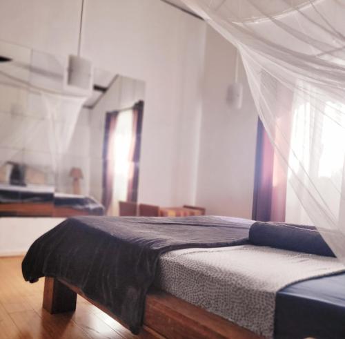 Postel nebo postele na pokoji v ubytování Sannyasa Wellness and Spa