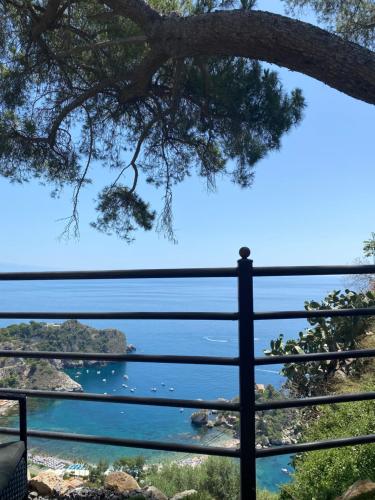 a view of the ocean from a balcony at Le Ancorette in Giardini Naxos