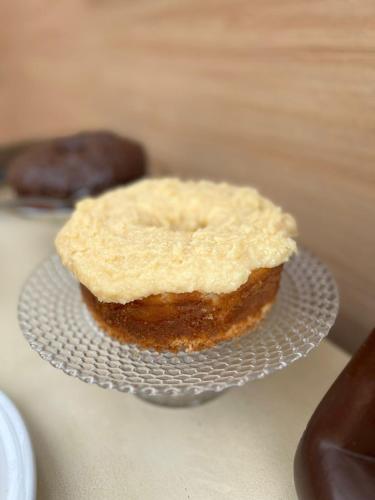 a piece of cake on a plate on a table at Pousada Pangea Tropical in Arraial d'Ajuda
