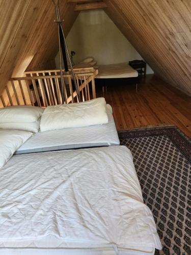Postel nebo postele na pokoji v ubytování Norrekås Beach Studios