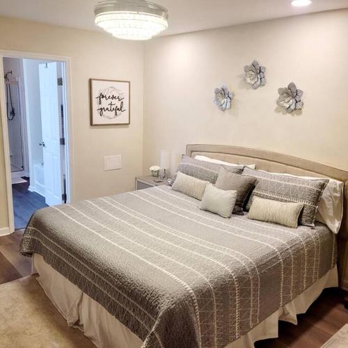a bedroom with a large bed in a room at Modern & Luxurious 3 Bdrm 2.5 Bath Townhome in Apex