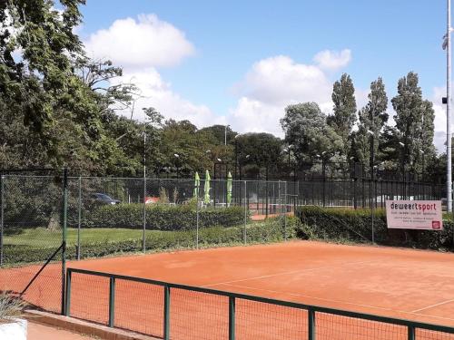a tennis court with a sign on top of it at Umi in Ostend