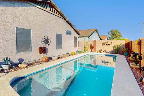 a swimming pool in front of a house at Gold Canyon Getaway in Gold Canyon