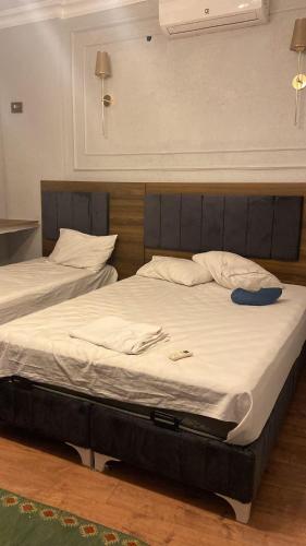 Ένα ή περισσότερα κρεβάτια σε δωμάτιο στο Aruna Boutique Hotel