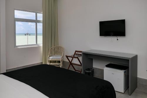 TV a/nebo společenská místnost v ubytování Yak Beach Hotel Natal