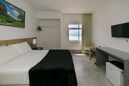 Postel nebo postele na pokoji v ubytování Yak Beach Hotel Natal